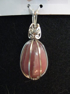 P-39 Rhodochrosite egg wrapped in sterling silver $35.jpg